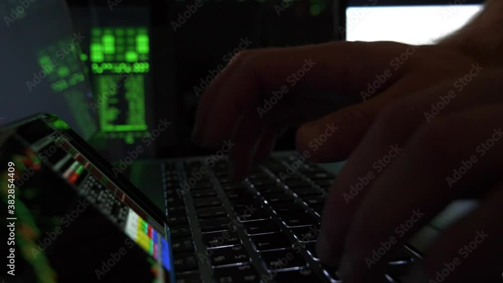 Hacker hands writing codes and Breaking Into Data Servers or stock ...