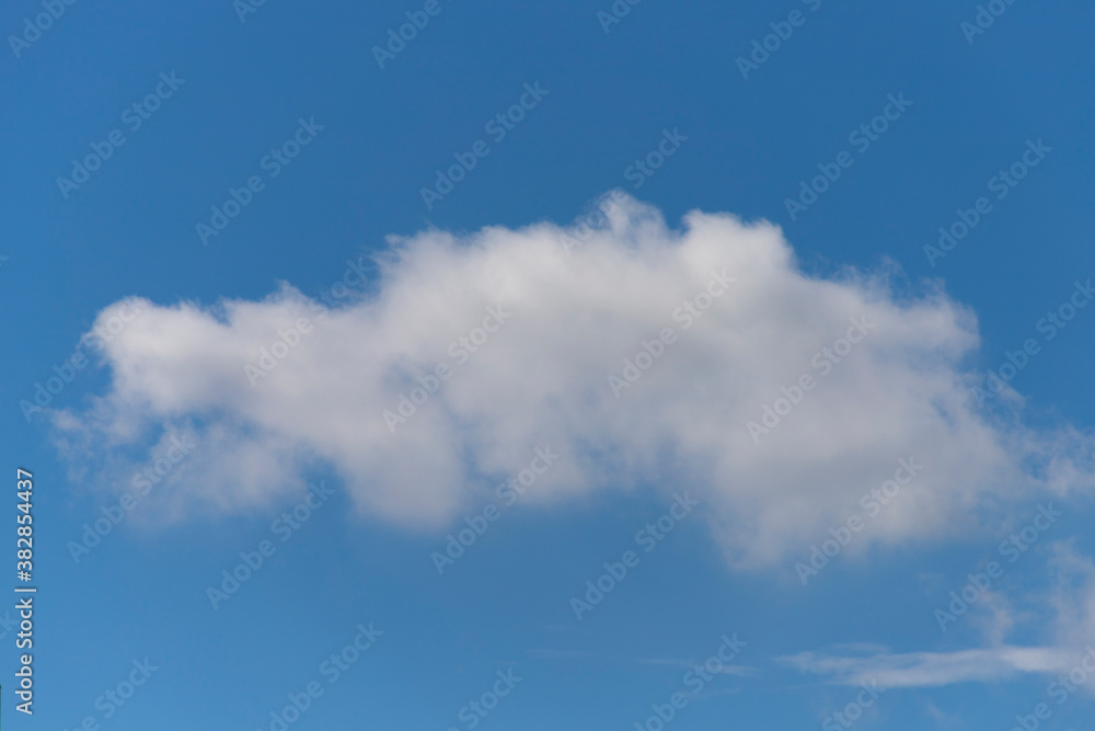 Fluffy white cloud formation in a beautiful blue sky Fluffy white cloud formation in a beautiful blue sky