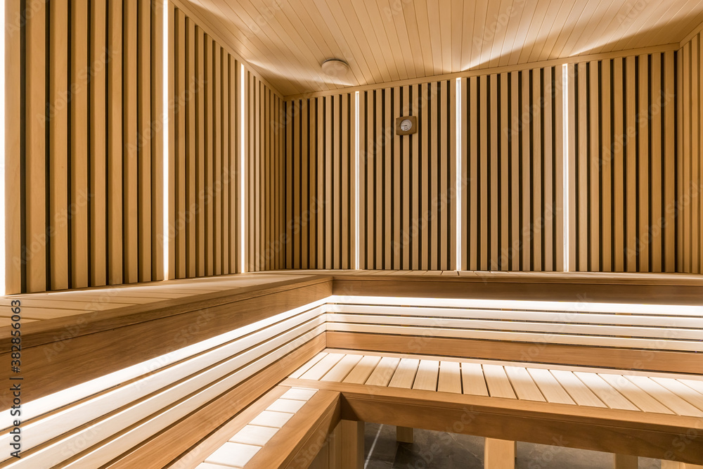 Modern wooden sauna interior with elegant lighting Modern wooden sauna interior with elegant lighting