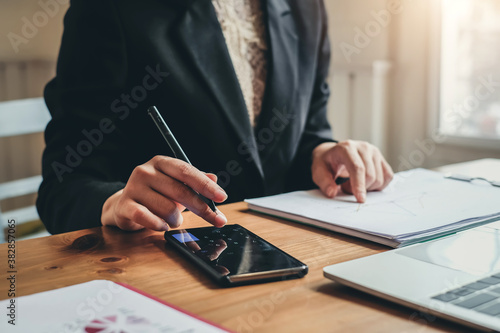 Woman financial manager taking notes information in office.