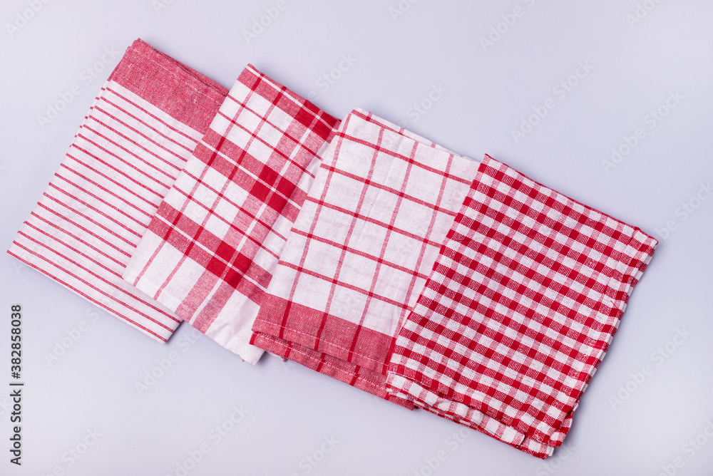 Four Folded Red White Napkin or Towels on Blue Background Top View Horizontal Four Folded Red White Napkin or Towels on Blue Background Top View Horizontal