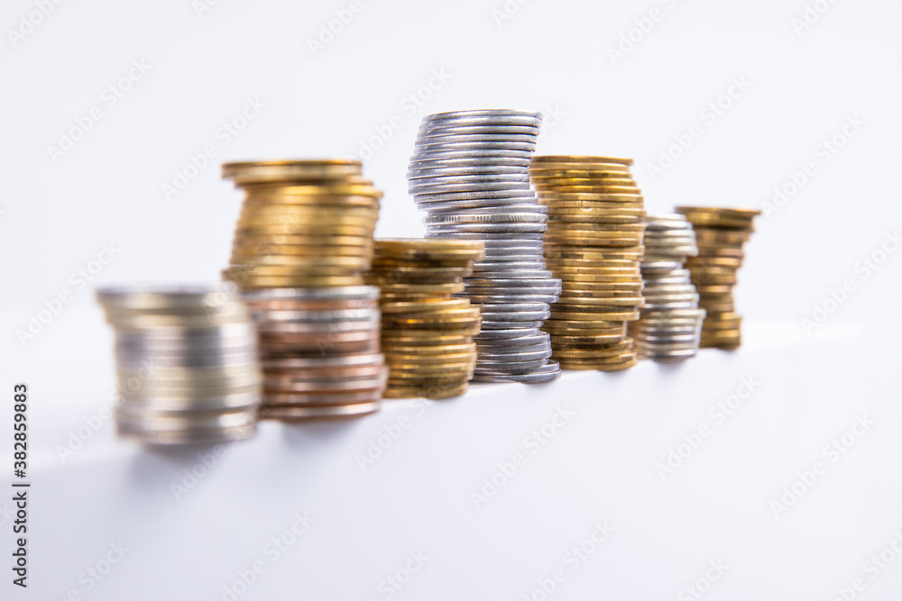 collection of colorful metal coins isolated on white background, close view collection of colorful metal coins isolated on white background, close view