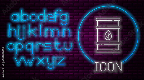 Glowing neon line Bio fuel barrel icon isolated on brick wall background. Eco bio and canister. Green environment and recycle. Neon light alphabet. Vector.