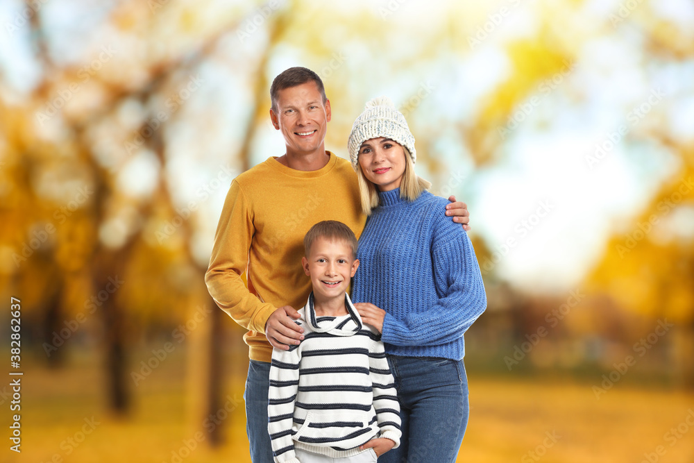 Happy family spending time together at autumn park Happy family spending time together at autumn park