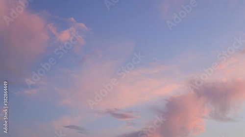 Beautiful pink clouds during sunset, blue sky with clouds background.