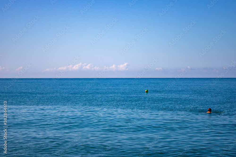 Sunrise on a summer warm morning at the sea in Sochi Russia.