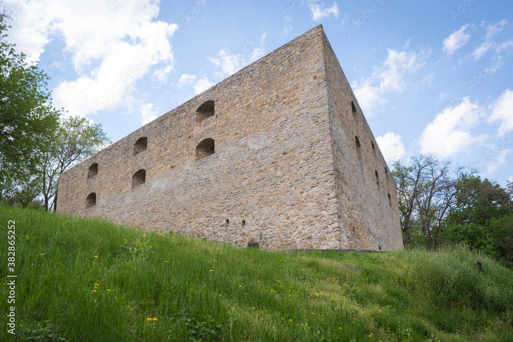 Old Chigirinsky castle, fortress on a green hill on a blue sky with clouds background, Ukraine
