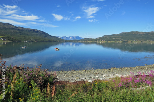 Panorama view of a beautiful fjord landscape with mountains and a blue sky in the North of Norway, Europe