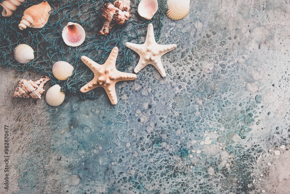 composition of exotic sea shells and starfish on blue background, top view. Summer sea flat lay - obrazy, fototapety, plakaty 