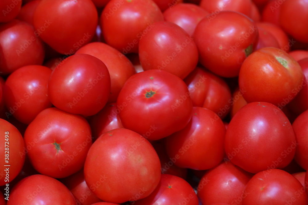 Fresh tomatoes on the counter in the store. Farmers fair Fresh tomatoes on the counter in the store. Farmers fair