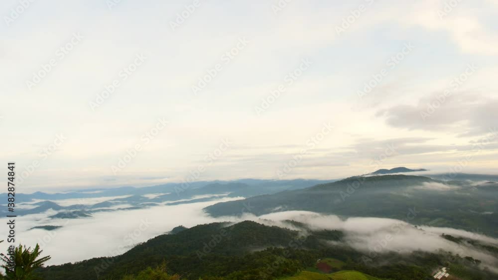 Beautiful time lapse of nature and mist foggy flows around the green mountains in the morning with mild sunshine.Mon Jam in winter Chiang Mai Province, Thailand Beautiful time lapse of nature and mist foggy flows around the green mountains in the morning with mild sunshine.Mon Jam in winter Chiang Mai Province, Thailand