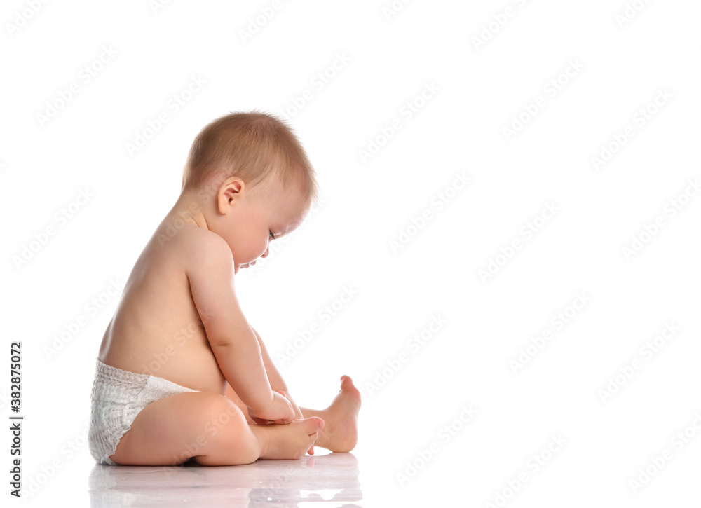 Cute little baby in nappy on floor studio portrait Cute little baby in nappy on floor studio portrait