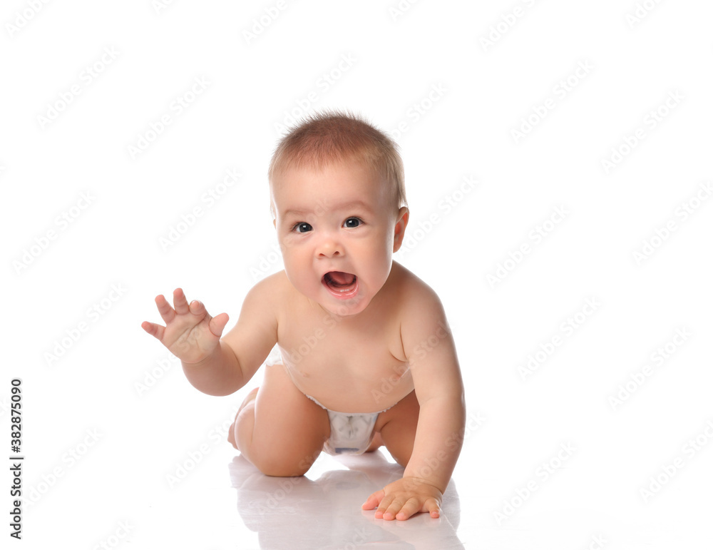 Cute little baby with evil smile crawling on floor Cute little baby with evil smile crawling on floor