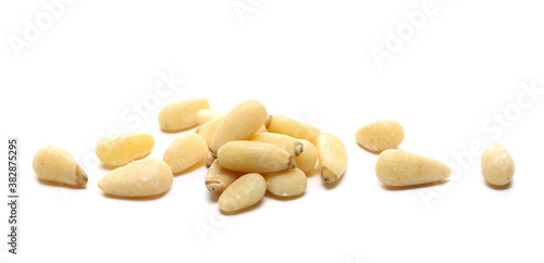 Pine nuts pile isolated on white background