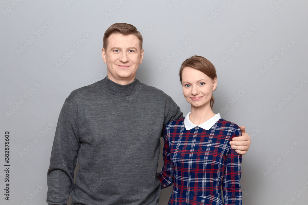 Portrait of happy man and woman hugging each other and smiling Portrait of happy man and woman hugging each other and smiling