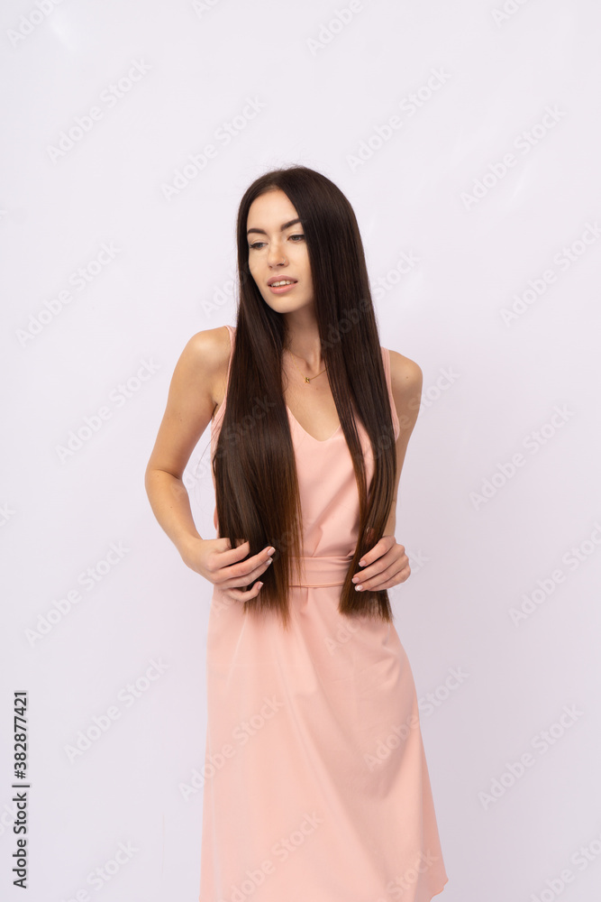 Young woman with long hair. Brunette