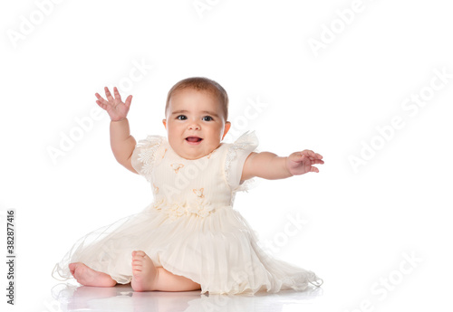 Portrait of a sweet infant girl isolated on white in studio.
