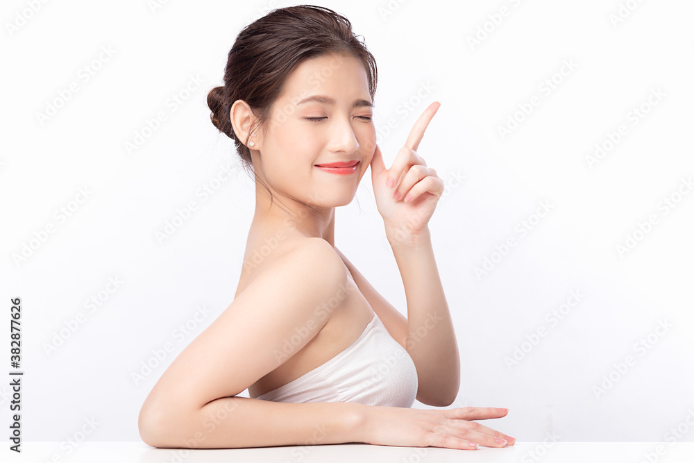 Young asian woman natural beauty makeup, Fashion model, Health wellness, Beautiful girl skin care and facial treatment. Isolated on beige background. With copy space for your text. Young asian woman natural beauty makeup, Fashion model, Health wellness, Beautiful girl skin care and facial treatment. Isolated on beige background. With copy space for your text.