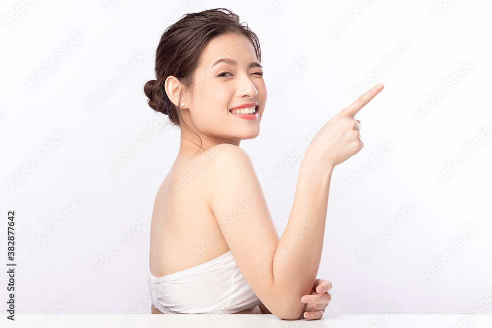 Young asian woman natural beauty makeup, Fashion model, Health wellness, Beautiful girl skin care and facial treatment. Isolated on beige background. With copy space for your text. Young asian woman natural beauty makeup, Fashion model, Health wellness, Beautiful girl skin care and facial treatment. Isolated on beige background. With copy space for your text.