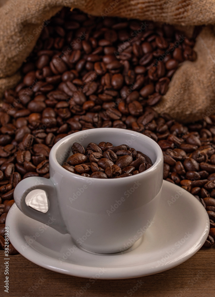 Coffee cup with coffee bag on wooden table