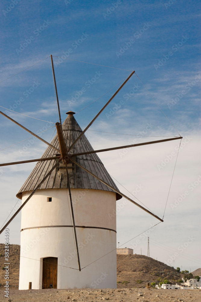 white windmill in the spain desert