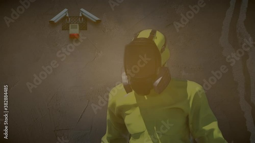 Man in yellow hazmat suit toxic envronment photo
