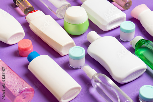 Group of plastic bodycare bottle Flat lay composition with cosmetic products on colored background empty space for you design. Set of White Cosmetic containers, top view with copy space