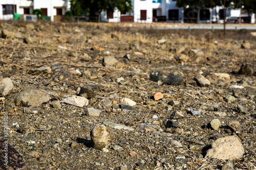 ground with stones and houses background