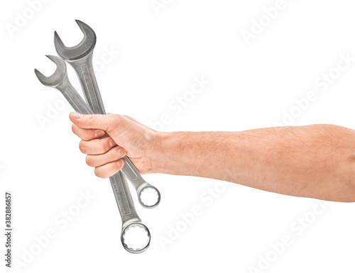 Mechanic hand hold spanner tool in hand isolated on white