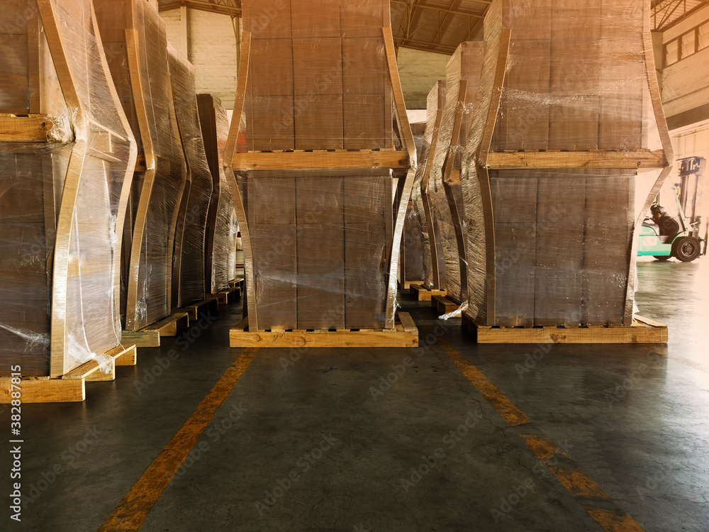 Shipment cartons box on pallets and wooden case on forklift in interior warehouse cargo for export and sorting goods in freight logistics and transportation industrial, delivery service Shipment cartons box on pallets and wooden case on forklift in interior warehouse cargo for export and sorting goods in freight logistics and transportation industrial, delivery service