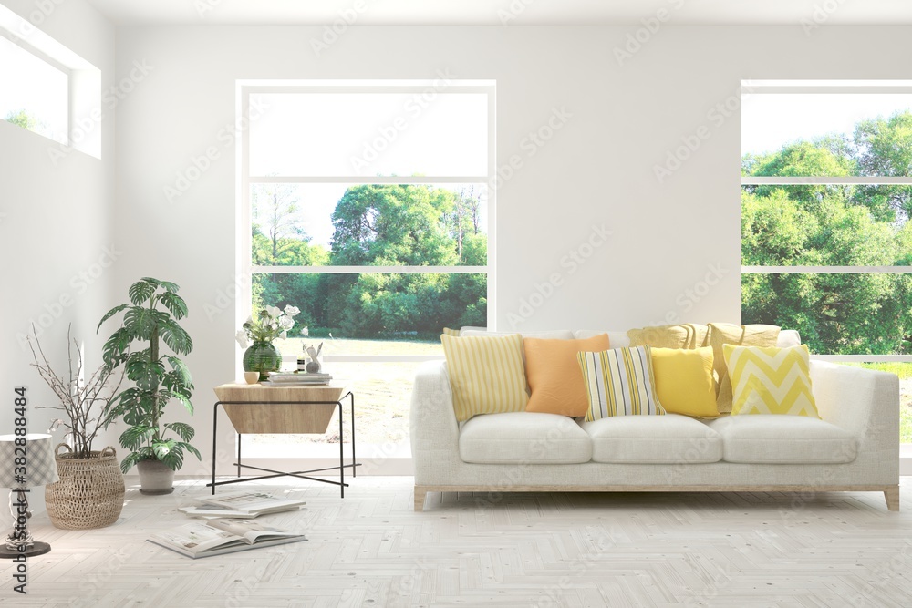 Fototapeta premium White living room with sofa and summer landscape in window. Scandinavian interior design. 3D illustration
