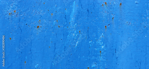 Beautiful cracked blue paint on rusty iron