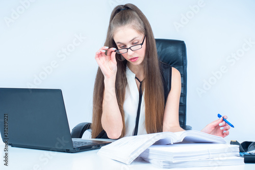 A woman works with accounti...