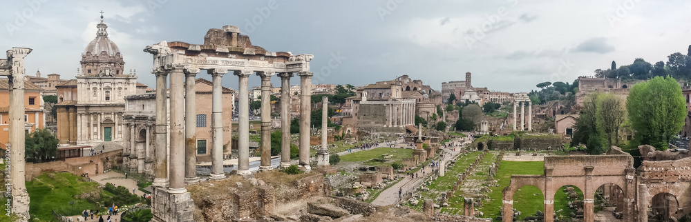 Ultra wide view of the ancient Roman Forum and the Colosseum in background