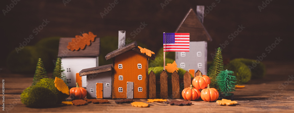 Miniature Thanksgiving little autumn cottages village in the forest, banner