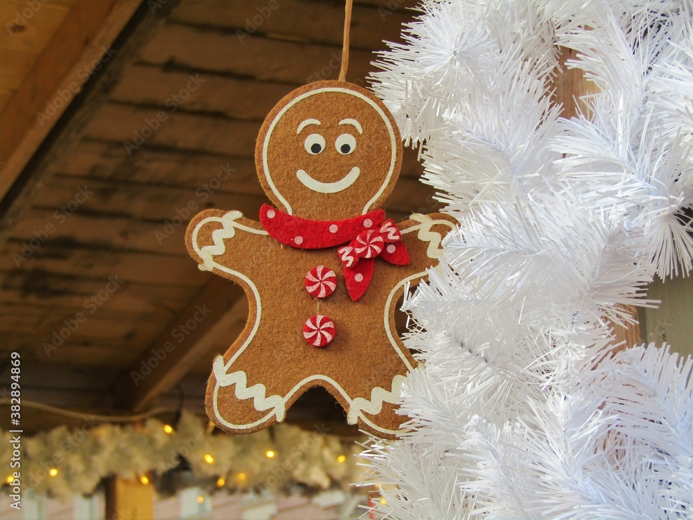 Hanging smiling gingerbread man with Christmas decoration in the famous Christmas market in Budapest, Hungary