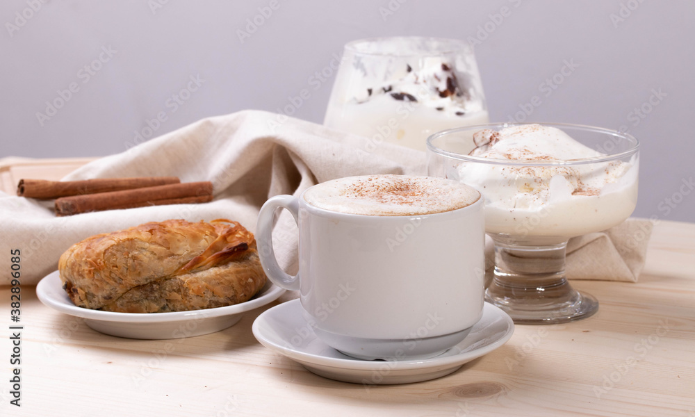 a white ceramic cup of cappucino as a coffee break concept a white ceramic cup of cappucino as a coffee break concept