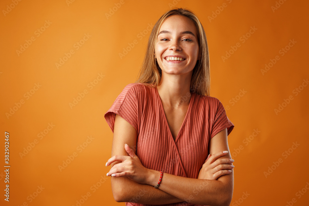 Obraz premium Portrait of a young beautiful happy woman smiling