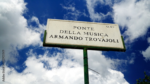 Rome, Italy - May 22, 2019: Marble street plaque of the Ponte della Musica-Armando Trovajoli. pedestrian bridge dedicated to the Italian pianist, composer and conductor who died in 2013 photo