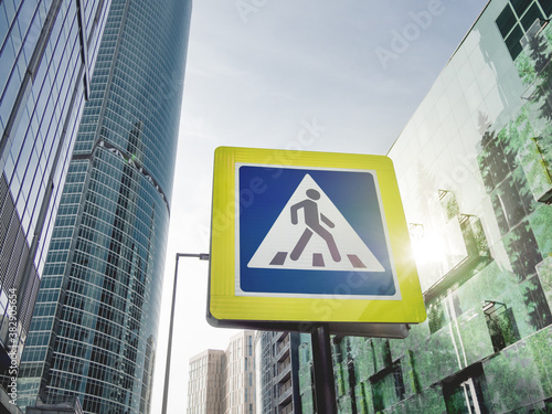 Traffic sign - pedestrian crossing. Urban cityscape. Pictogram of man walking on zebra crossing. Traffic sign. City road marking.
