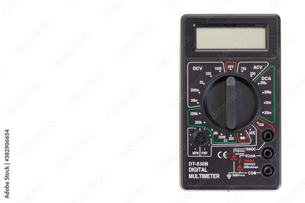 Digital electrical tester multimeter in black case isolated on white background. Digital multimeters have a numeric display, can measure voltage, current and resistance. Close-up. Digital electrical tester multimeter in black case isolated on white background. Digital multimeters have a numeric display, can measure voltage, current and resistance. Close-up.