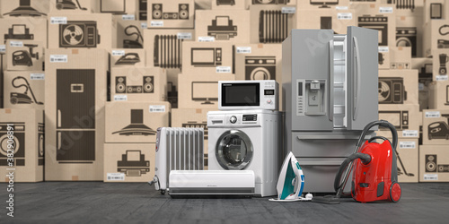 фотографія Household appliances and kitchen electronics in cardboard boxes in warehouse