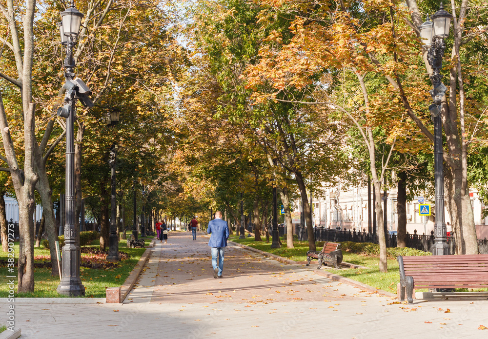 Rozhdestvensky Boulevard in Moscow, Russia. Autumn. Trees. Houses. Peolpe walking Rozhdestvensky Boulevard in Moscow, Russia. Autumn. Trees. Houses. Peolpe walking