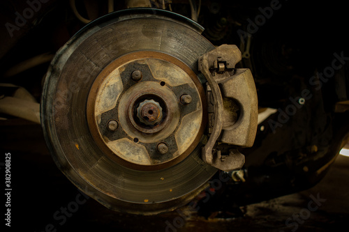 car tire in repair and car in service center or garage