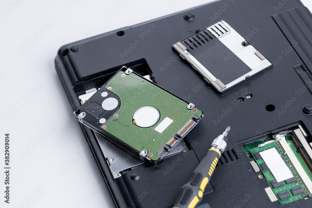 technician worker repairing laptop pc. restore hard disk data store concept. computer hardware repair service conceptual. person checking hdd disk technician worker repairing laptop pc. restore hard disk data store concept. computer hardware repair service conceptual. person checking hdd disk