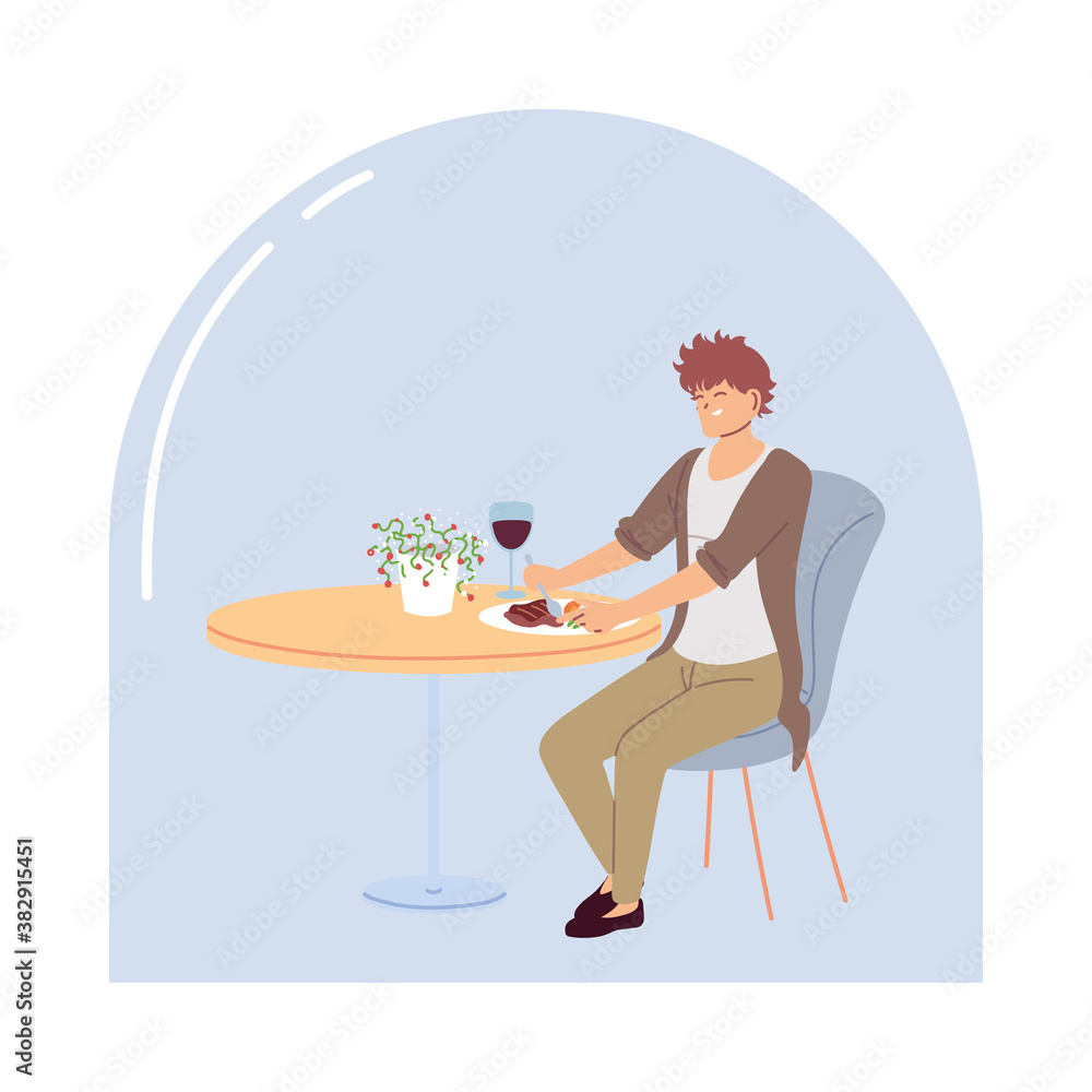 young man sitting in a restaurant having dinner with a glass of wine young man sitting in a restaurant having dinner with a glass of wine