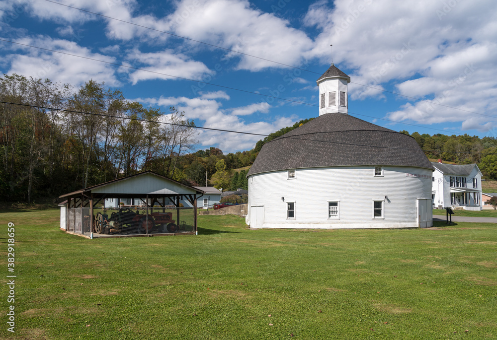 Fototapeta premium Well preserved white wooden round barn with cupola in Mannington, West Virginia