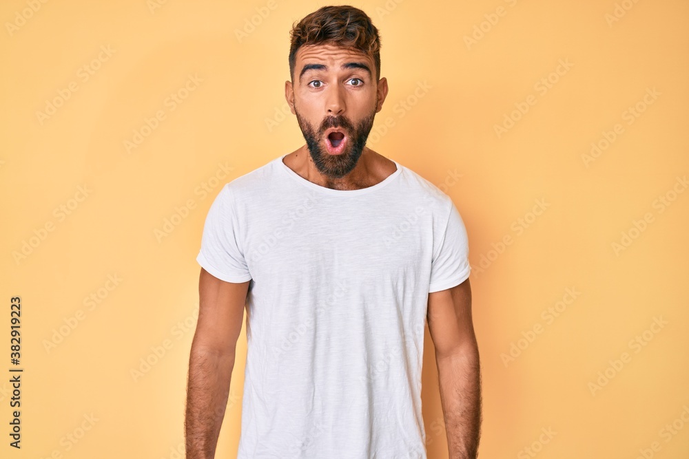 Young hispanic man wearing casual clothes scared and amazed with open mouth for surprise, disbelief face Young hispanic man wearing casual clothes scared and amazed with open mouth for surprise, disbelief face