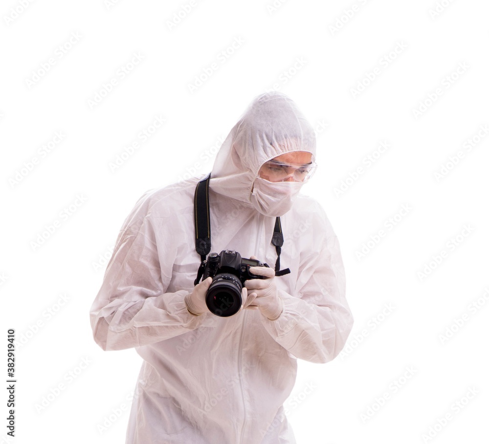 Forensic specialist in protective suit taking photos on white Forensic specialist in protective suit taking photos on white