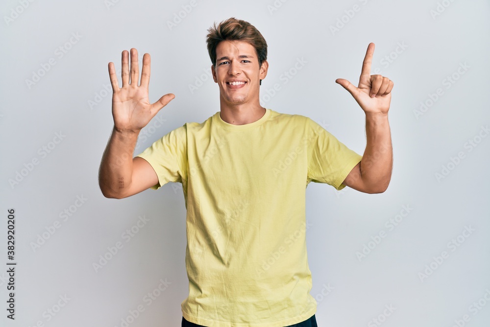 Handsome caucasian man wearing casual clothes showing and pointing up with fingers number seven while smiling confident and happy. Handsome caucasian man wearing casual clothes showing and pointing up with fingers number seven while smiling confident and happy.